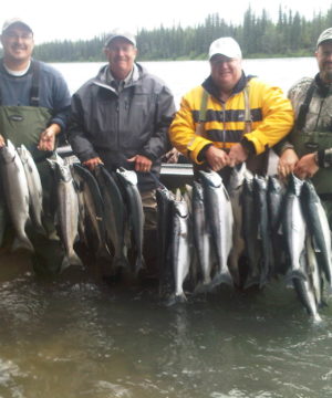 four guys holding their big sockeye catch